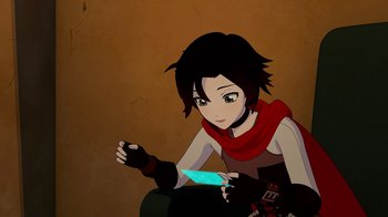 Movie still from “Justice League x RWBY: Super Heroes and Huntsmen Part Two” (2023), directed by Yssa Badiola – A woman sitting on a chair holding a remote control; Medium shot, High angle