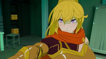 Movie still from “Justice League x RWBY: Super Heroes and Huntsmen Part Two” (2023), directed by Yssa Badiola – A woman with blonde hair wearing a red scarf; Close Up shot, Over the shoulder angle