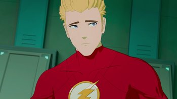Movie still from “Justice League x RWBY: Super Heroes and Huntsmen Part Two” (2023), directed by Yssa Badiola – A man with blonde hair wearing a red and yellow costume; Close Up shot, Over the shoulder angle