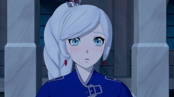Movie still from “Justice League x RWBY: Super Heroes and Huntsmen Part Two” (2023), directed by Yssa Badiola – A girl in a blue uniform is looking at the camera; Close Up shot, Over the shoulder angle