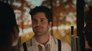 Movie still from “Atlanta” (2016), created by Donald Glover – A person wearing a shirt and suspenders; Close Up shot, Over the shoulder angle