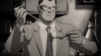 Movie still from “Justice Society: World War II” (2021), directed by Jeff Wamester – A man in a suit and tie holding a pair of scissors; Medium shot, High angle