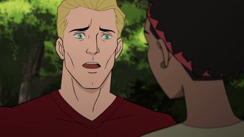 Movie still from “Justice Society: World War II” (2021), directed by Jeff Wamester – A man with green eyes and blond hair talking to another man; Close Up shot, Over the shoulder angle