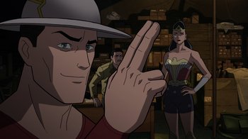 Movie still from “Justice Society: World War II” (2021), directed by Jeff Wamester – A man holding up his middle finger in front of a woman; Medium shot, Over the shoulder angle