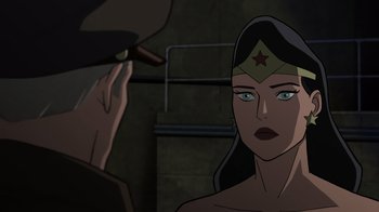 Movie still from “Justice Society: World War II” (2021), directed by Jeff Wamester – Wonder woman in the middle of a conversation with an older man; Close Up shot, Over the shoulder angle