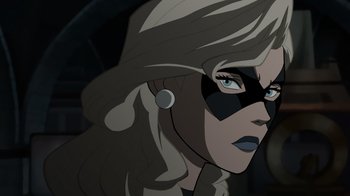 Movie still from “Justice Society: World War II” (2021), directed by Jeff Wamester – A woman's face with a mask on; Close Up shot, Over the shoulder angle