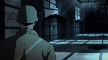 Movie still from “Justice Society: World War II” (2021), directed by Jeff Wamester – A man standing in front of a door way; Wide shot, High angle