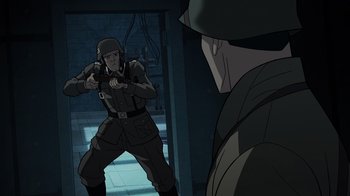 Movie still from “Justice Society: World War II” (2021), directed by Jeff Wamester – An image of a man in a military uniform pointing a gun at another man in a military uniform; Medium shot, Over the shoulder angle
