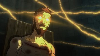 Movie still from “Justice Society: World War II” (2021), directed by Jeff Wamester – A man with a beard is looking at the camera; Medium shot, High angle