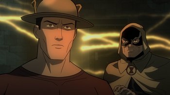 Movie still from “Justice Society: World War II” (2021), directed by Jeff Wamester – A man with a hat is looking at the camera with another man; Medium shot, Over the shoulder angle