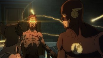 Movie still from “Justice Society: World War II” (2021), directed by Jeff Wamester – A man is standing next to the flash in a room; Medium shot, Over the shoulder angle
