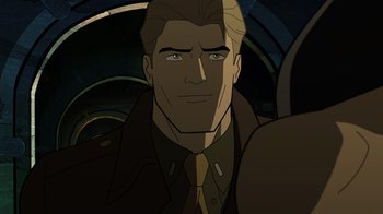 Movie still from “Justice Society: World War II” (2021), directed by Jeff Wamester – A person wearing a suit and tie; Close Up shot, High angle
