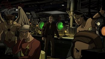 Movie still from “Justice Society: World War II” (2021), directed by Jeff Wamester – A man standing in front of a group of people; Wide shot, High angle