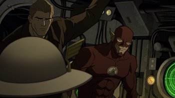 Movie still from “Justice Society: World War II” (2021), directed by Jeff Wamester – A man and a man in a flash costume in front of an officer; Medium shot, Over the shoulder angle
