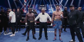Movie still from “KSI: In Real Life” (2023), directed by Wes Pollitt – Three men standing in a boxing ring with their hands on their hips; Wide shot, Low angle