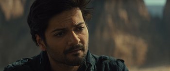 Movie still from “Kandahar” (2023), directed by Ric Roman Waugh – A person wearing a shirt; Close Up shot, Over the shoulder angle