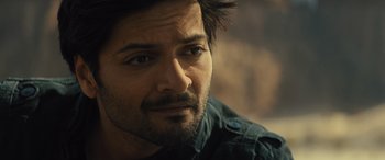 Movie still from “Kandahar” (2023), directed by Ric Roman Waugh – A person wearing a shirt; Close Up shot, Over the shoulder angle