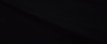 Movie still from “Kandahar” (2023), directed by Ric Roman Waugh – A car driving down a dark road in the dark; Extreme Wide shot, High angle