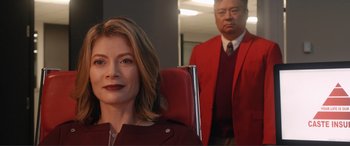 A man and a woman in a red suit
