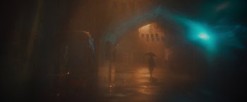 Movie still from “Khufiya” (2023), directed by Vishal Bhardwaj – A person with an umbrella walking down a street; Extreme Wide shot, Low angle