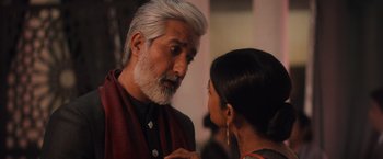 Movie still from “Khufiya” (2023), directed by Vishal Bhardwaj – An older man talking to a young woman in a room; Close Up shot, Over the shoulder angle