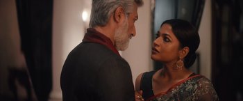 Movie still from “Khufiya” (2023), directed by Vishal Bhardwaj – A man and a woman standing next to each other; Close Up shot, Low angle