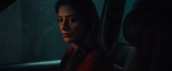 Movie still from “Khufiya” (2023), directed by Vishal Bhardwaj – A woman sitting in a car looking into the distance; Close Up shot, Low angle