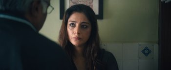 Movie still from “Khufiya” (2023), directed by Vishal Bhardwaj – A person looking at a mirror; Close Up shot, Over the shoulder angle