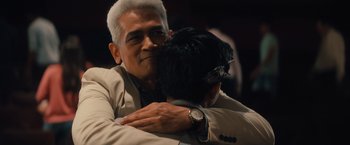 Movie still from “Khufiya” (2023), directed by Vishal Bhardwaj – A man is hugging another man in a suit; Close Up shot, Over the shoulder angle
