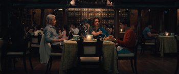 Movie still from “Khufiya” (2023), directed by Vishal Bhardwaj – A group of people sitting around a table at a restaurant; Wide shot, High angle
