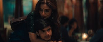 Movie still from “Khufiya” (2023), directed by Vishal Bhardwaj – A man and a woman sitting on top of each other; Close Up shot, High angle