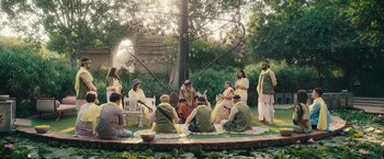 Movie still from “Khufiya” (2023), directed by Vishal Bhardwaj – A group of people gathered around a tree; Wide shot, High angle