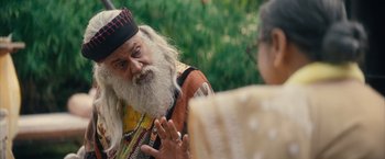 Movie still from “Khufiya” (2023), directed by Vishal Bhardwaj – An old man with a long white beard talking to an older woman; Medium shot, Over the shoulder angle