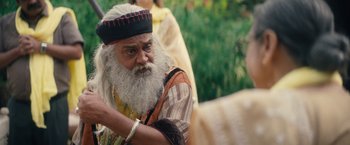Movie still from “Khufiya” (2023), directed by Vishal Bhardwaj – An old man with long white hair and a long beard; Close Up shot, Over the shoulder angle