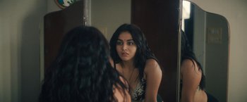 Movie still from “Khufiya” (2023), directed by Vishal Bhardwaj – A woman looking at her reflection in a mirror; Close Up shot, Over the shoulder angle