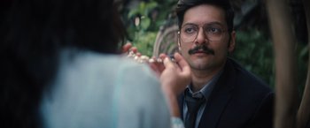 Movie still from “Khufiya” (2023), directed by Vishal Bhardwaj – A man in a suit and tie looking at a woman in a dress shirt; Close Up shot, Over the shoulder angle