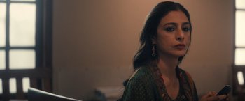 Movie still from “Khufiya” (2023), directed by Vishal Bhardwaj – A person sitting in a room; Close Up shot, Over the shoulder angle