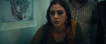 Movie still from “Khufiya” (2023), directed by Vishal Bhardwaj – A person sitting in a room; Close Up shot, Low angle