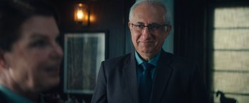 Movie still from “Khufiya” (2023), directed by Vishal Bhardwaj – An older man wearing a suit and tie; Close Up shot, Over the shoulder angle