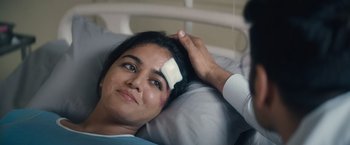 Movie still from “Khufiya” (2023), directed by Vishal Bhardwaj – A woman laying in a hospital bed with bandages on her head; Close Up shot, Over the shoulder angle