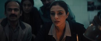 Movie still from “Khufiya” (2023), directed by Vishal Bhardwaj – A person wearing a suit and tie; Close Up shot, High angle