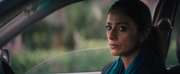 Movie still from “Khufiya” (2023), directed by Vishal Bhardwaj – A person sitting in a car looking out of the window; Close Up shot, Over the shoulder angle