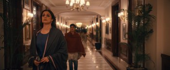 Movie still from “Khufiya” (2023), directed by Vishal Bhardwaj – Two women walking down a long hallway in a hotel; Medium shot, Low angle