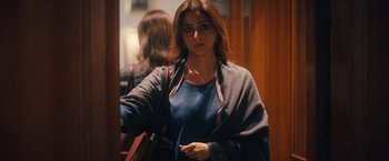 Movie still from “Khufiya” (2023), directed by Vishal Bhardwaj – A woman in a blue shirt and a black and red scarf; Medium shot, Low angle