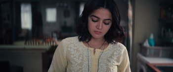 Movie still from “Khufiya” (2023), directed by Vishal Bhardwaj – A young woman wearing a white shirt and a black headband; Close Up shot, Low angle