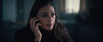 Movie still from “Khufiya” (2023), directed by Vishal Bhardwaj – A person talking on a cell phone; Close Up shot, Low angle