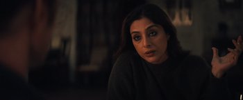 Movie still from “Khufiya” (2023), directed by Vishal Bhardwaj – A person sitting in a dark room; Close Up shot, High angle