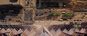 Movie still from “Kick-Ass” (2010), directed by Matthew Vaughn – An aerial view of a busy city street with cars; Extreme Wide shot, Overhead angle