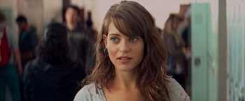 Movie still from “Kick-Ass” (2010), directed by Matthew Vaughn – A person with long brown hair; Close Up shot, Over the shoulder angle