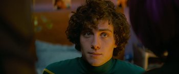 Movie still from “Kick-Ass” (2010), directed by Matthew Vaughn – A person with curly hair; Close Up shot, Over the shoulder angle